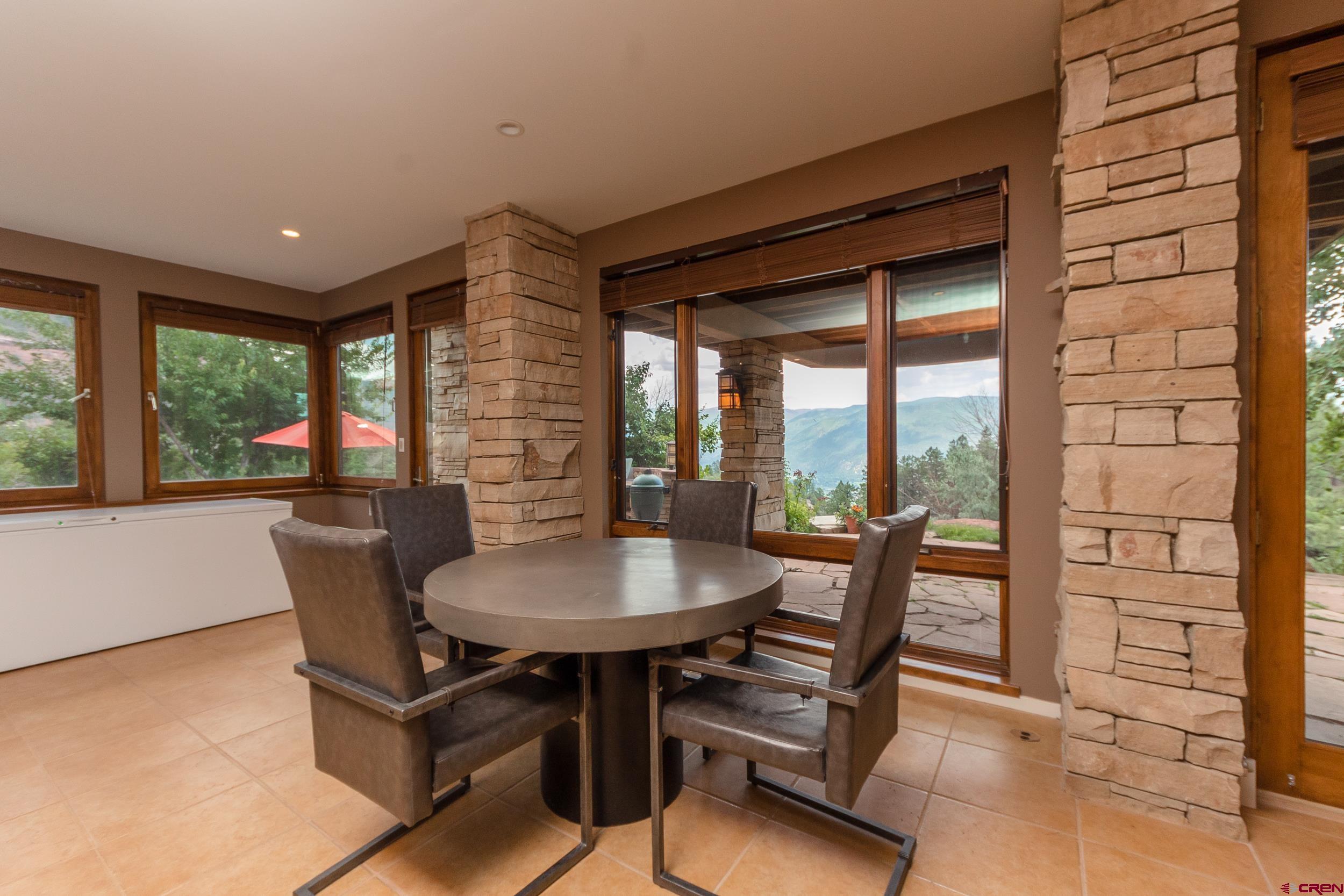 9475 High Meadows Durango, CO 81301 - Photo 24 of 35 a dining room with furniture and window