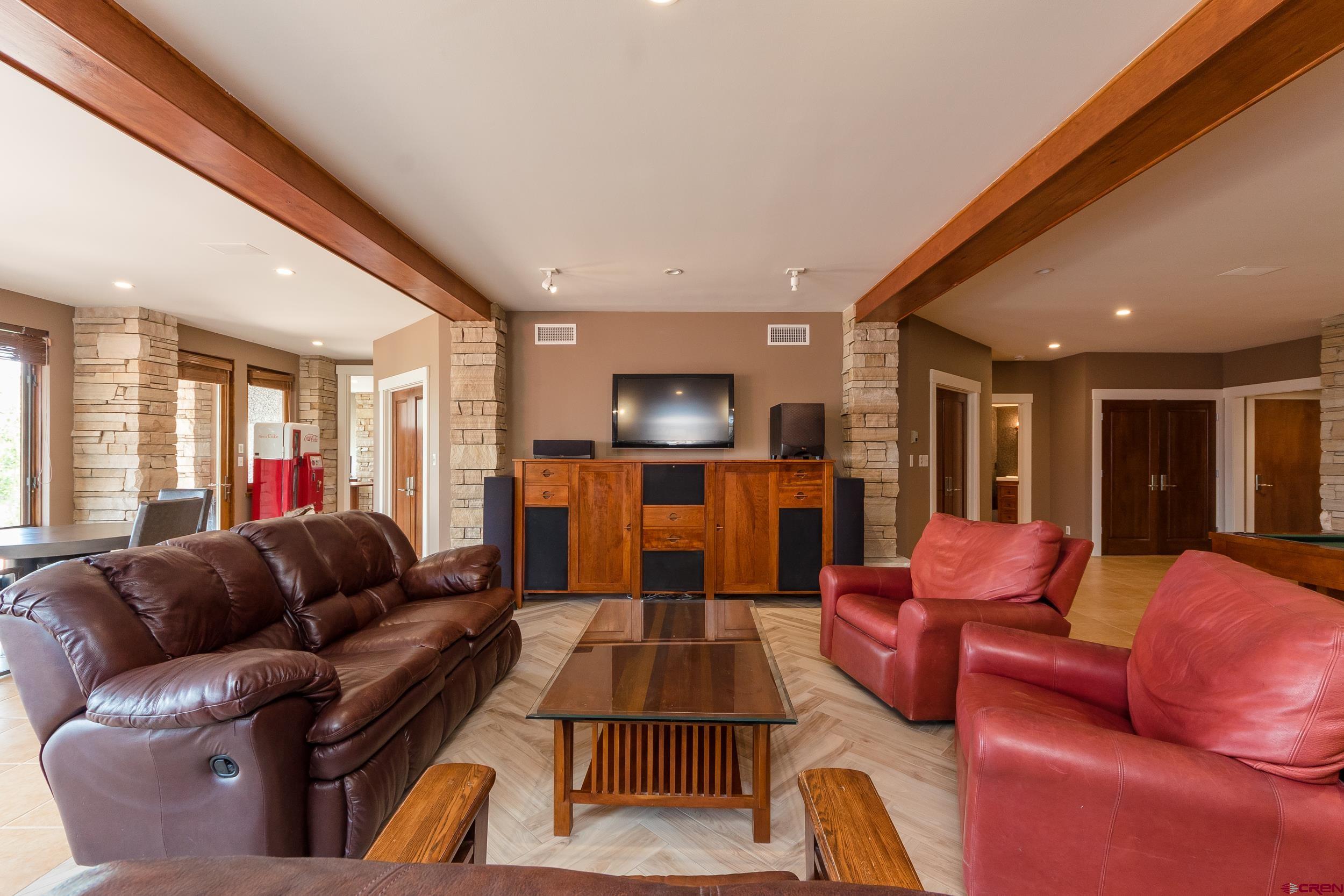 9475 High Meadows Durango, CO 81301 - Photo 25 of 35 a living room with furniture kitchen view and a large window