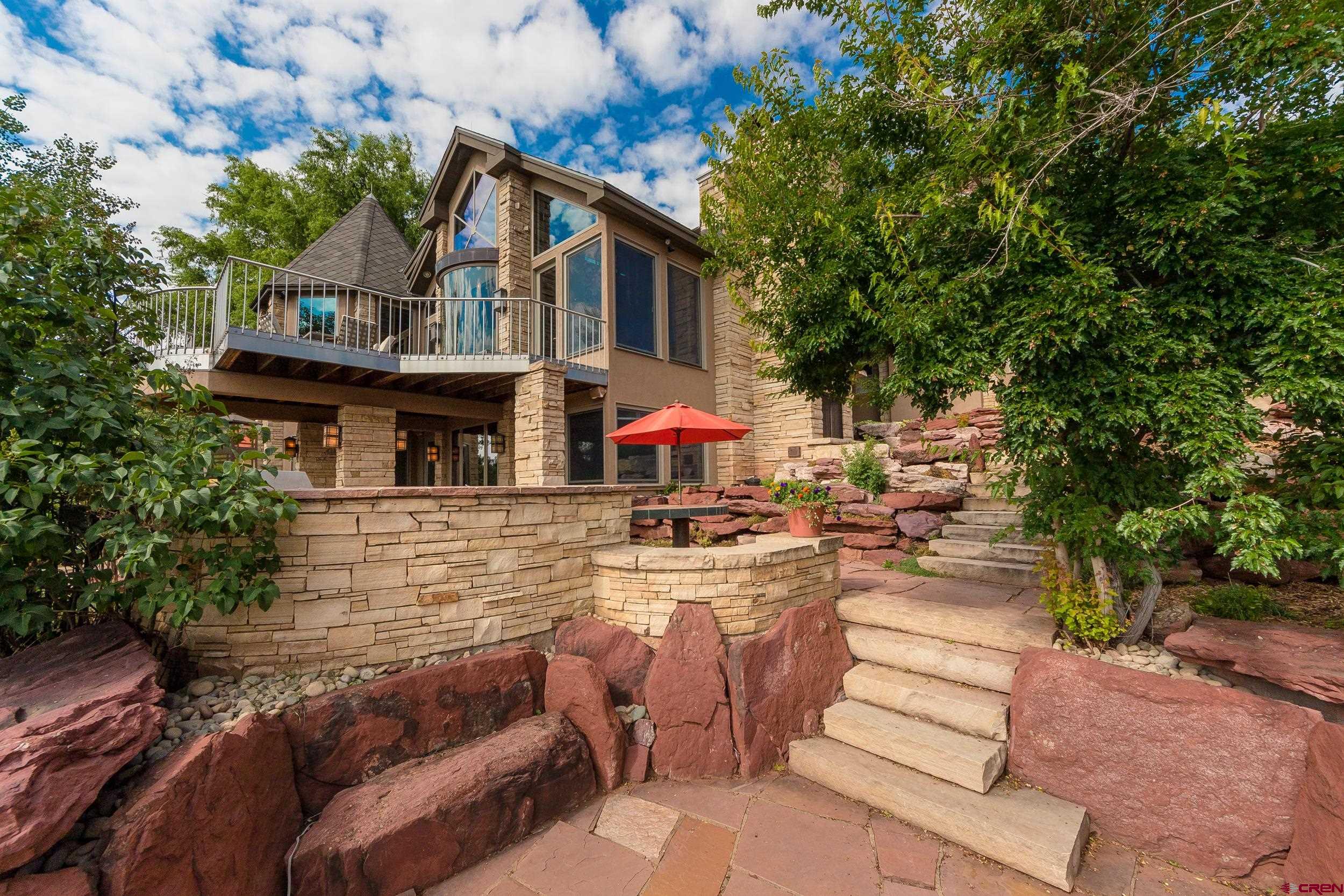 9475 High Meadows Durango, CO 81301 - Photo 29 of 35 a view of a house with backyard and sitting area