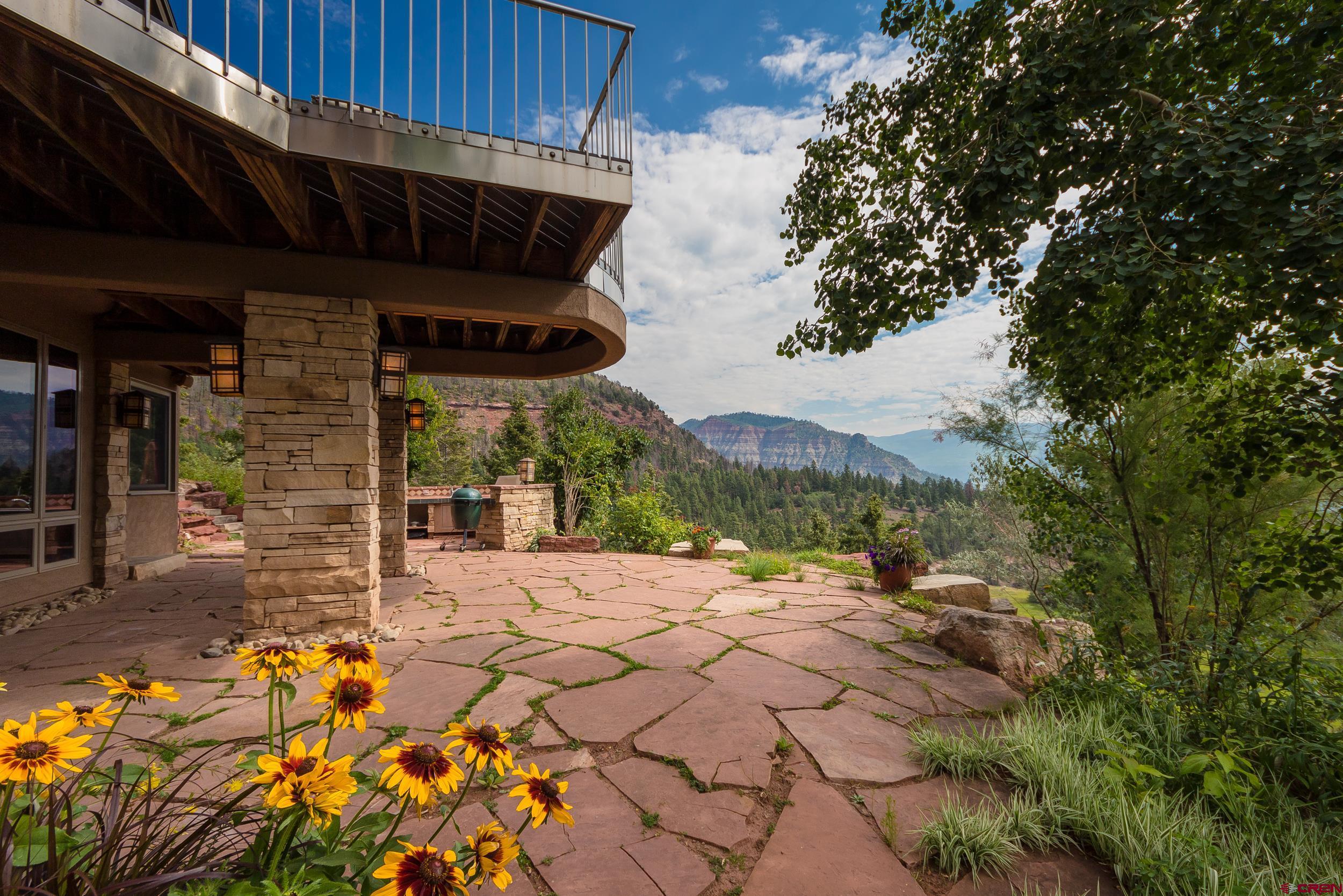 9475 High Meadows Durango, CO 81301 - Photo 30 of 35 a view of a backyard of a house with a fountain
