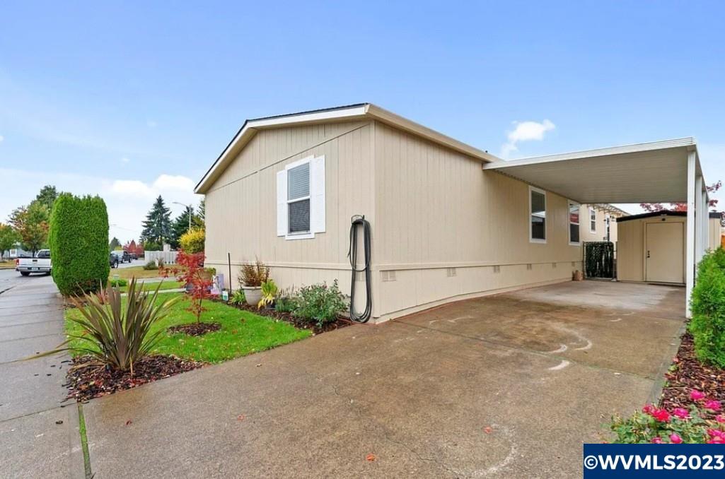 950 Hoffman Road Northeast, Unit 61 Salem, OR 97301 - Photo 1 of 40 a view of a house with a yard and plants