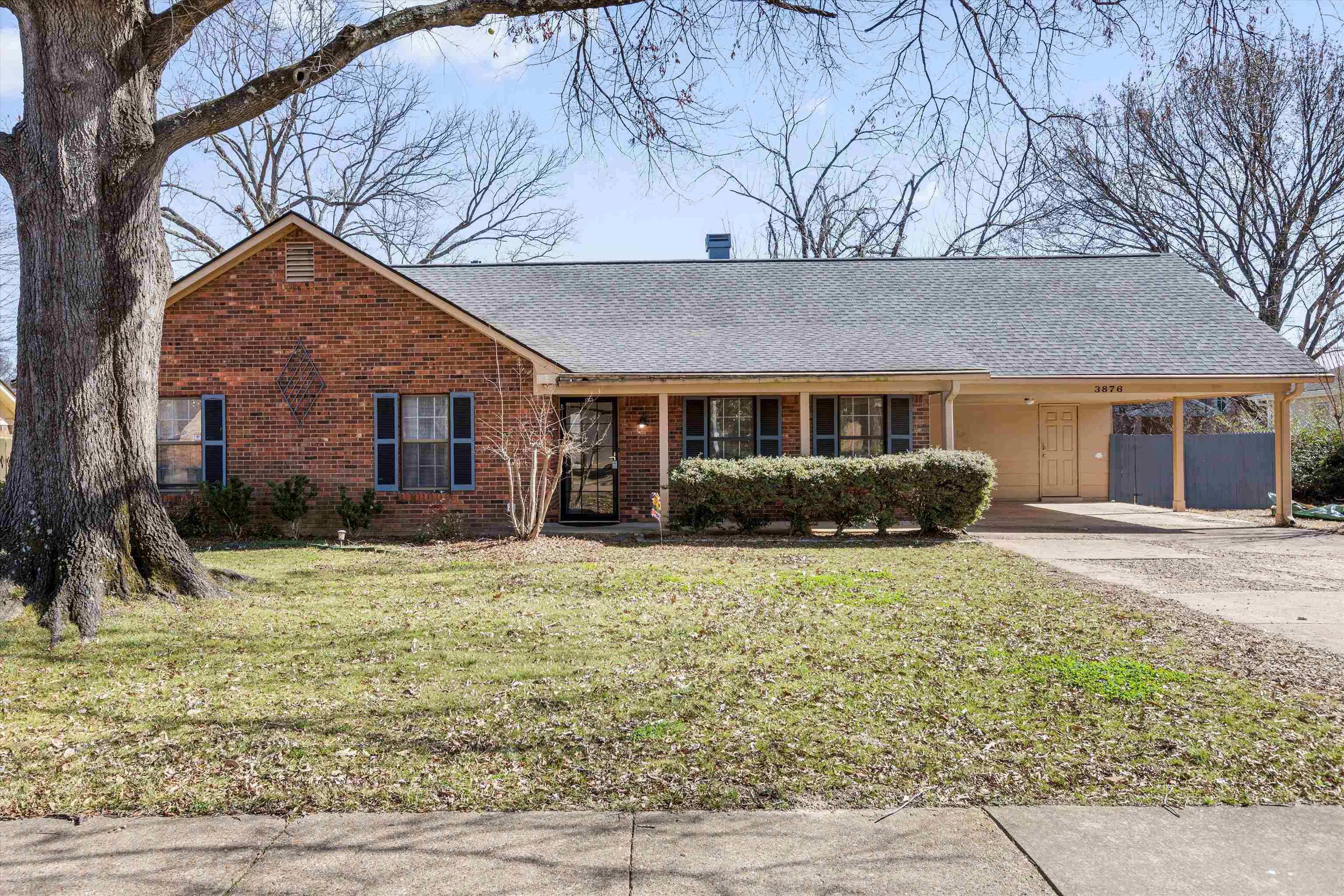 3876 Luther Road Bartlett, TN 38135 - Photo 1 of 20 a front view of a house with a yard and potted plants
