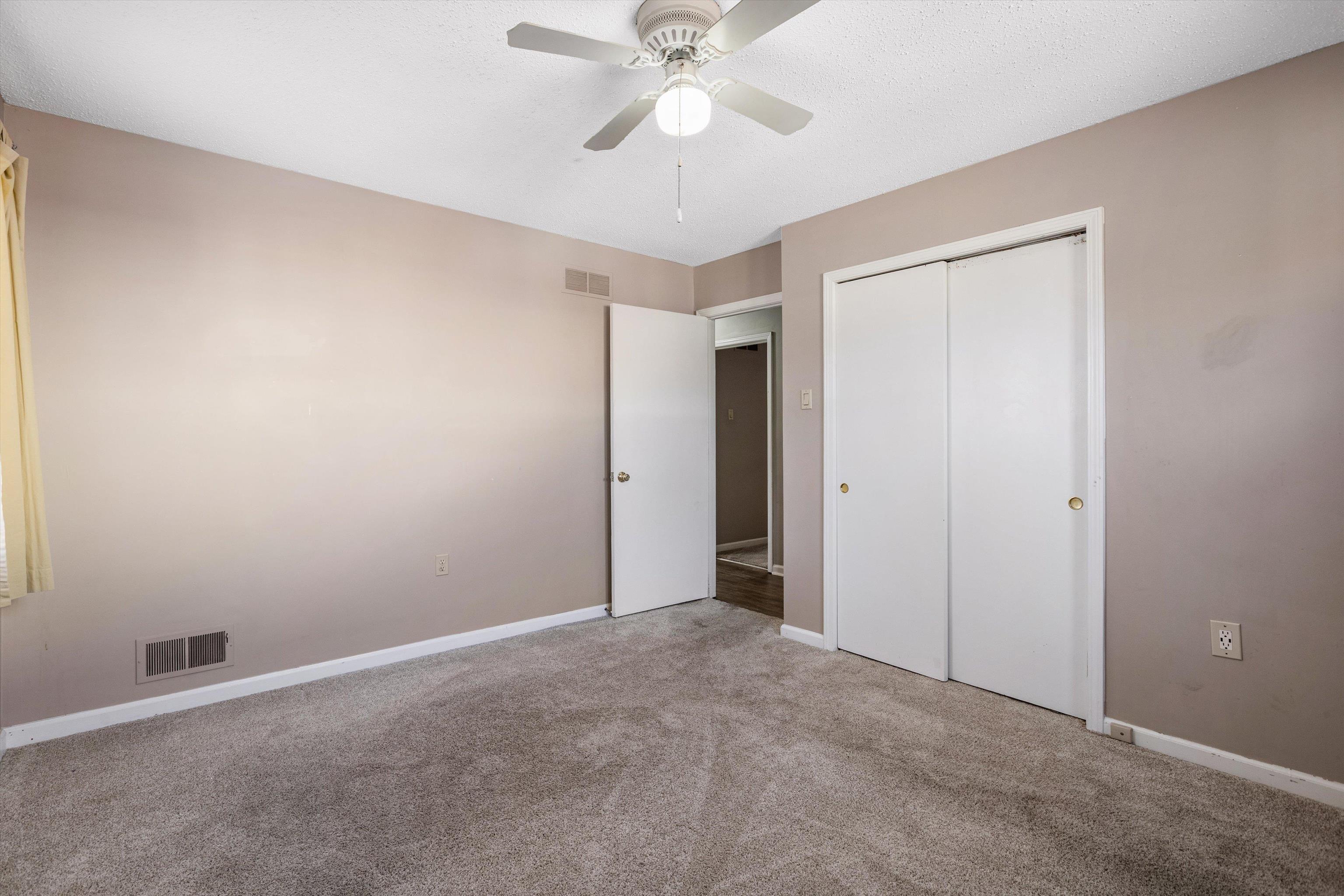 3876 Luther Road Bartlett, TN 38135 - Photo 13 of 20 a view of an empty room and chandelier fan