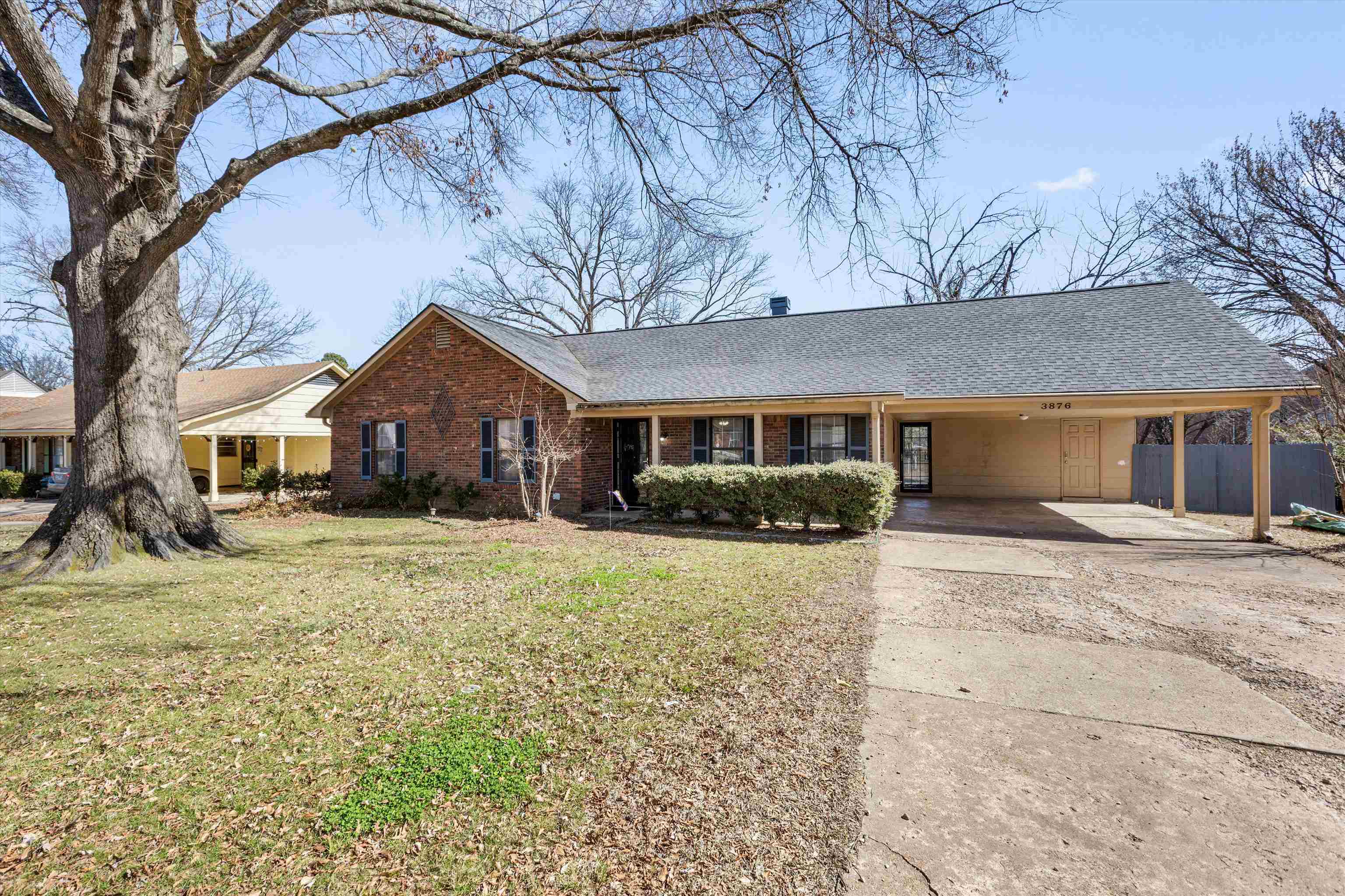 3876 Luther Road Bartlett, TN 38135 - Photo 2 of 20 a front view of a house with a yard and garage
