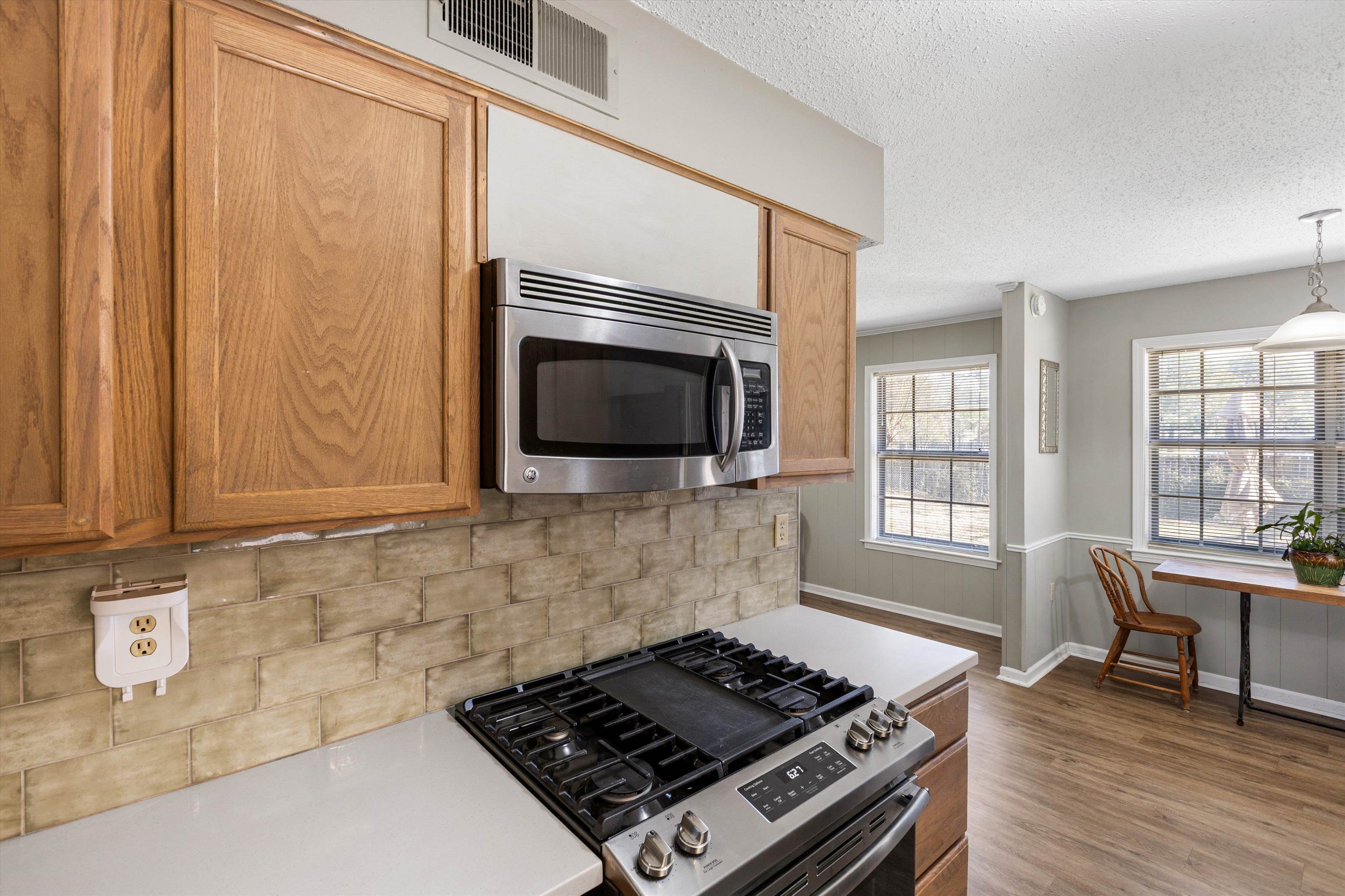 3876 Luther Road Bartlett, TN 38135 - Photo 3 of 20 a kitchen with a stove and a microwave