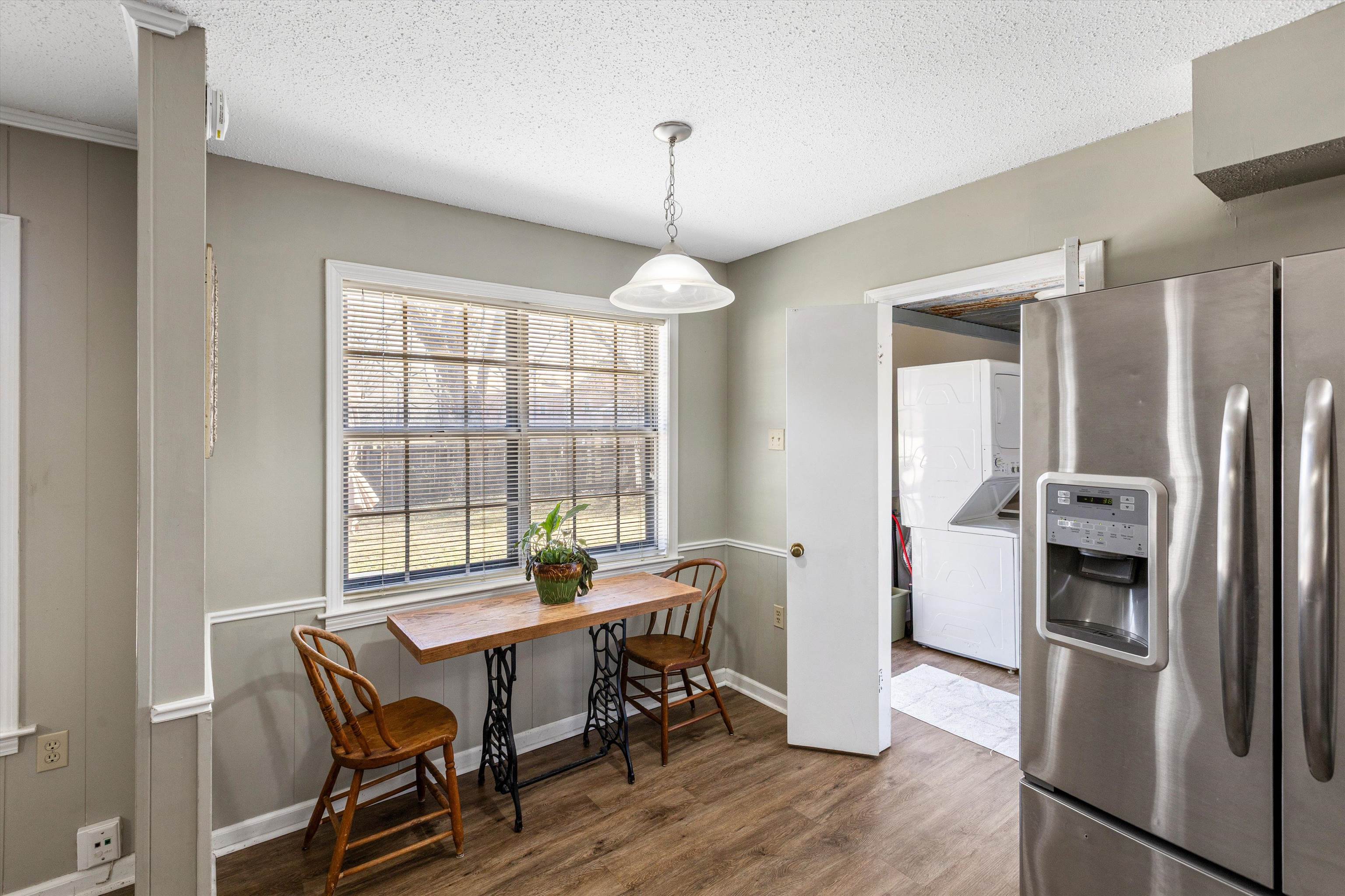3876 Luther Road Bartlett, TN 38135 - Photo 5 of 20 a dining room with furniture a chandelier and wooden floor