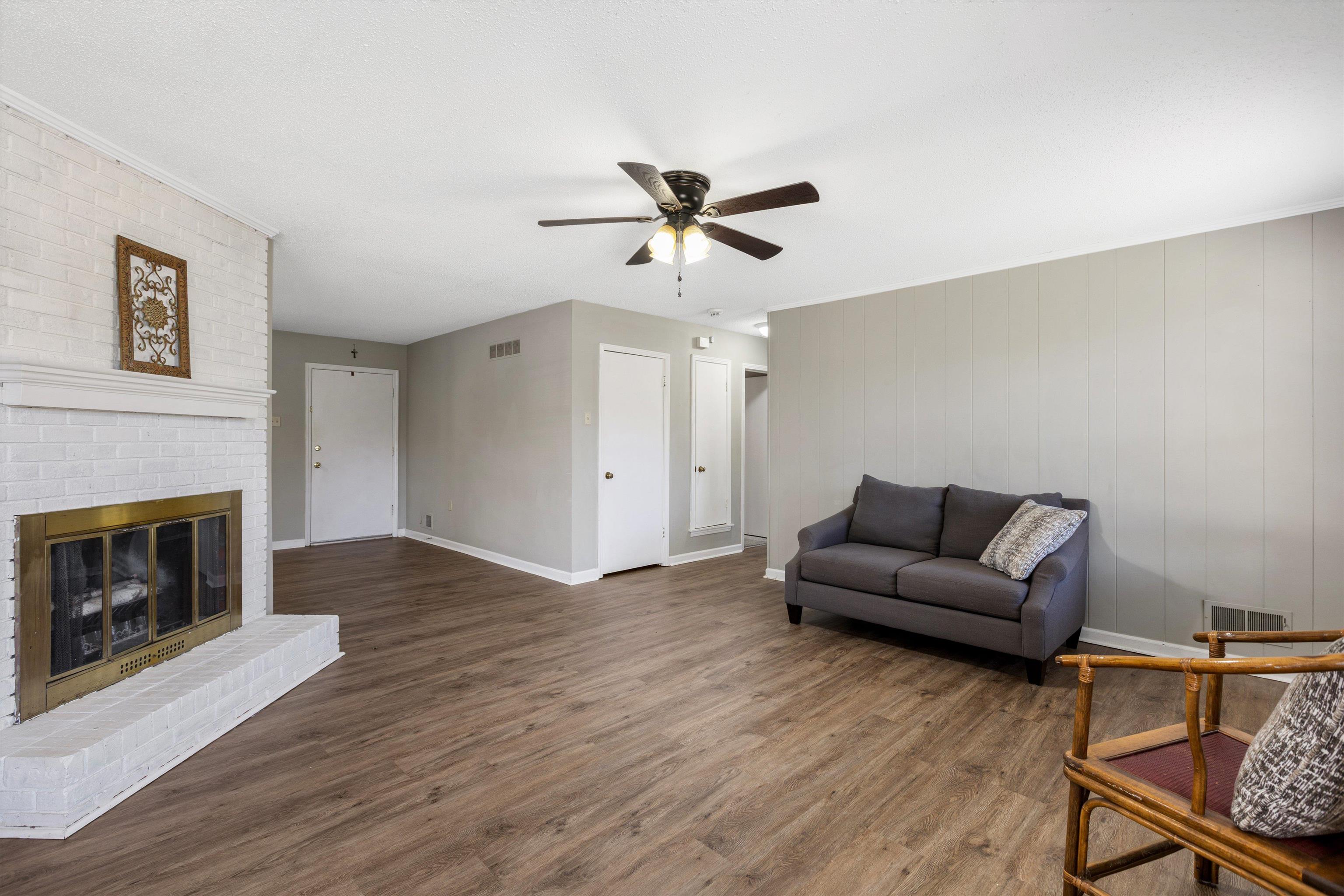 3876 Luther Road Bartlett, TN 38135 - Photo 8 of 20 a living room with furniture and a fireplace