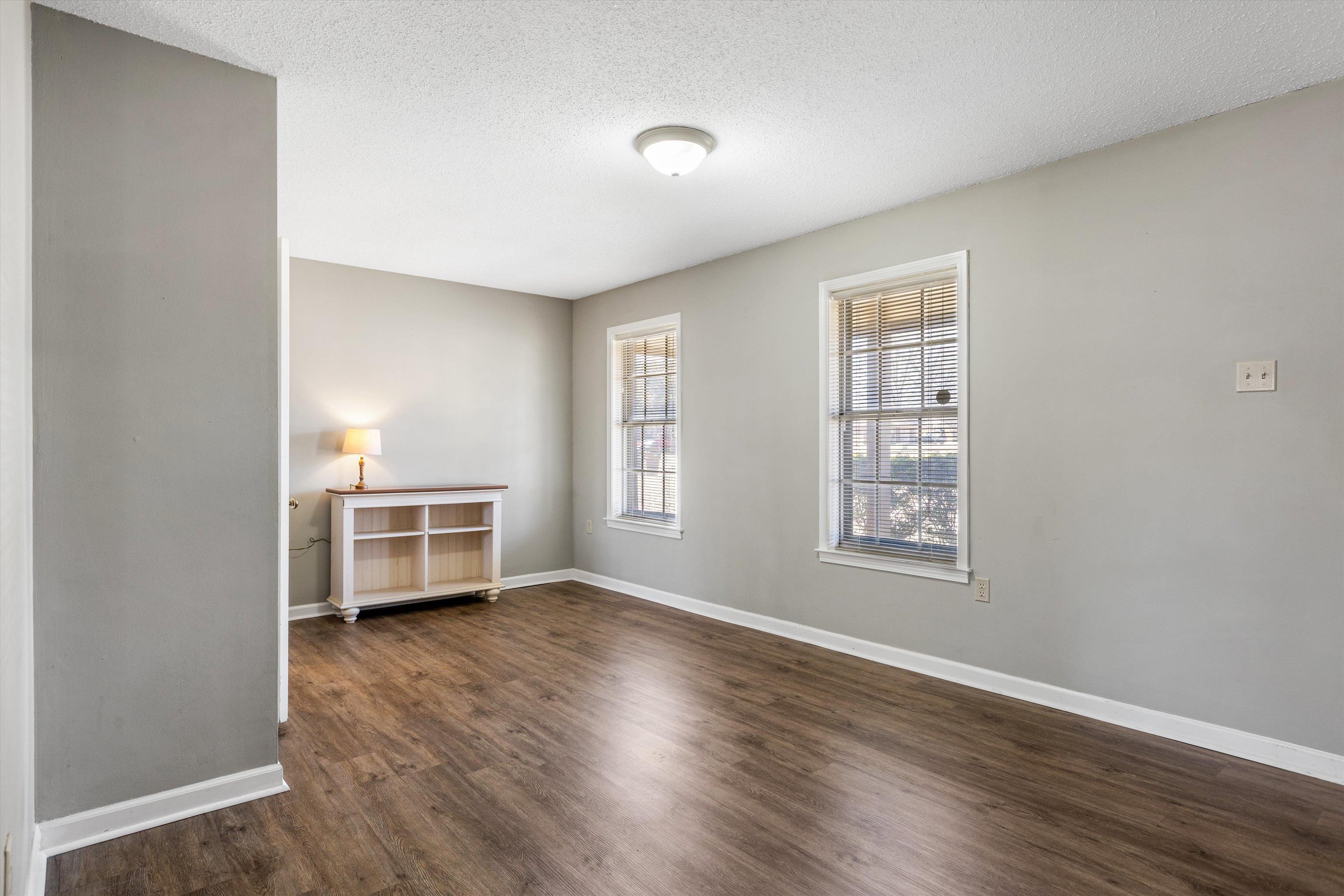 3876 Luther Road Bartlett, TN 38135 - Photo 9 of 20 Spare room featuring dark wood-style floors and a textured ceiling