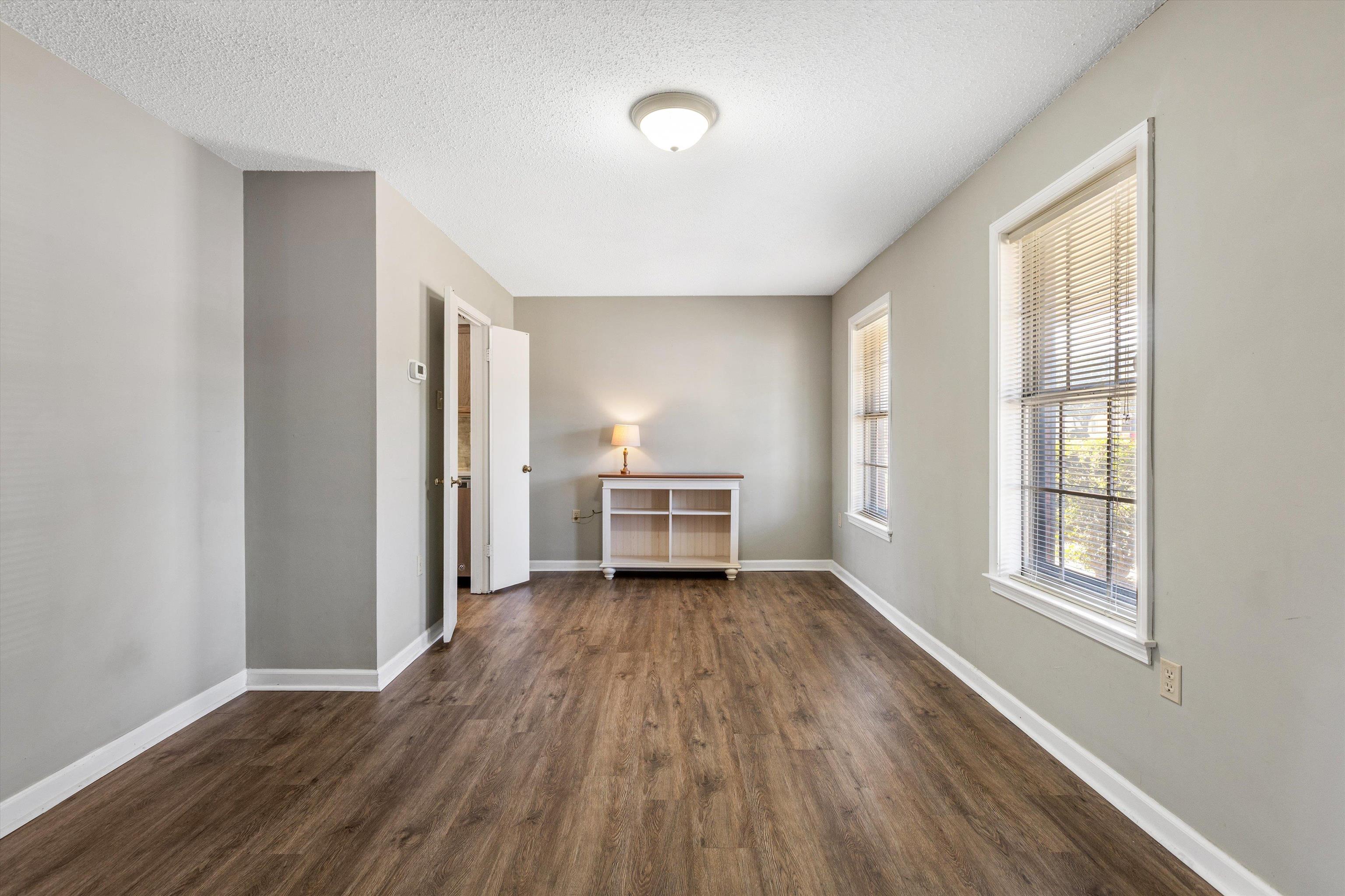 3876 Luther Road Bartlett, TN 38135 - Photo 10 of 20 a view of a room with wooden floor electronic appliances and windows