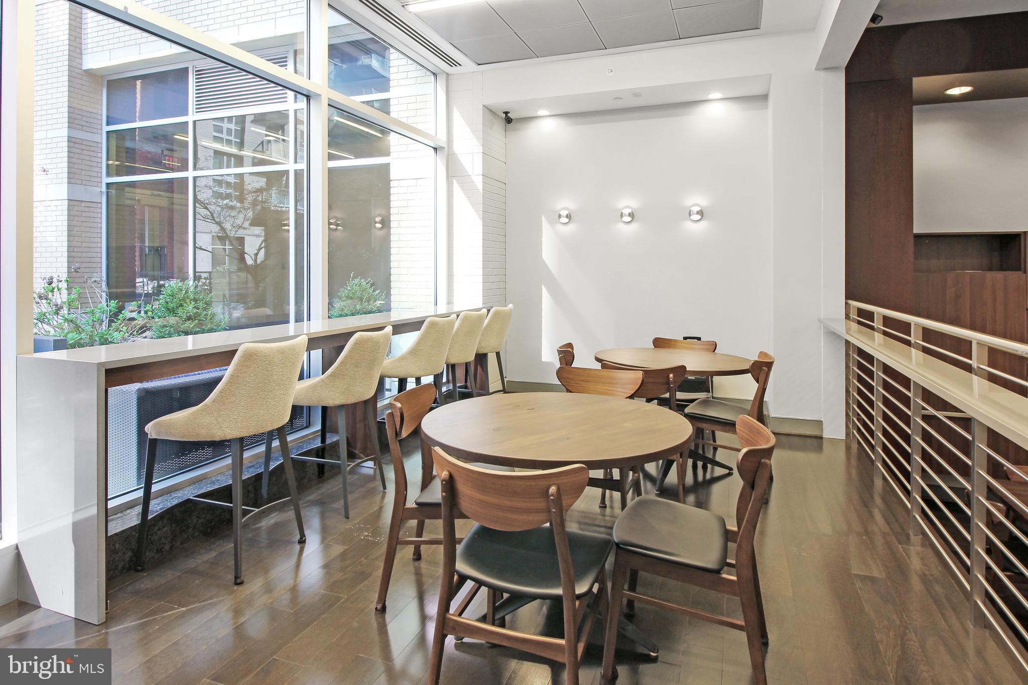 1025 First Street Southeast, Unit 612 Washington, DC 20003 - Photo 29 of 41 a view of a dining room with furniture and wooden floor