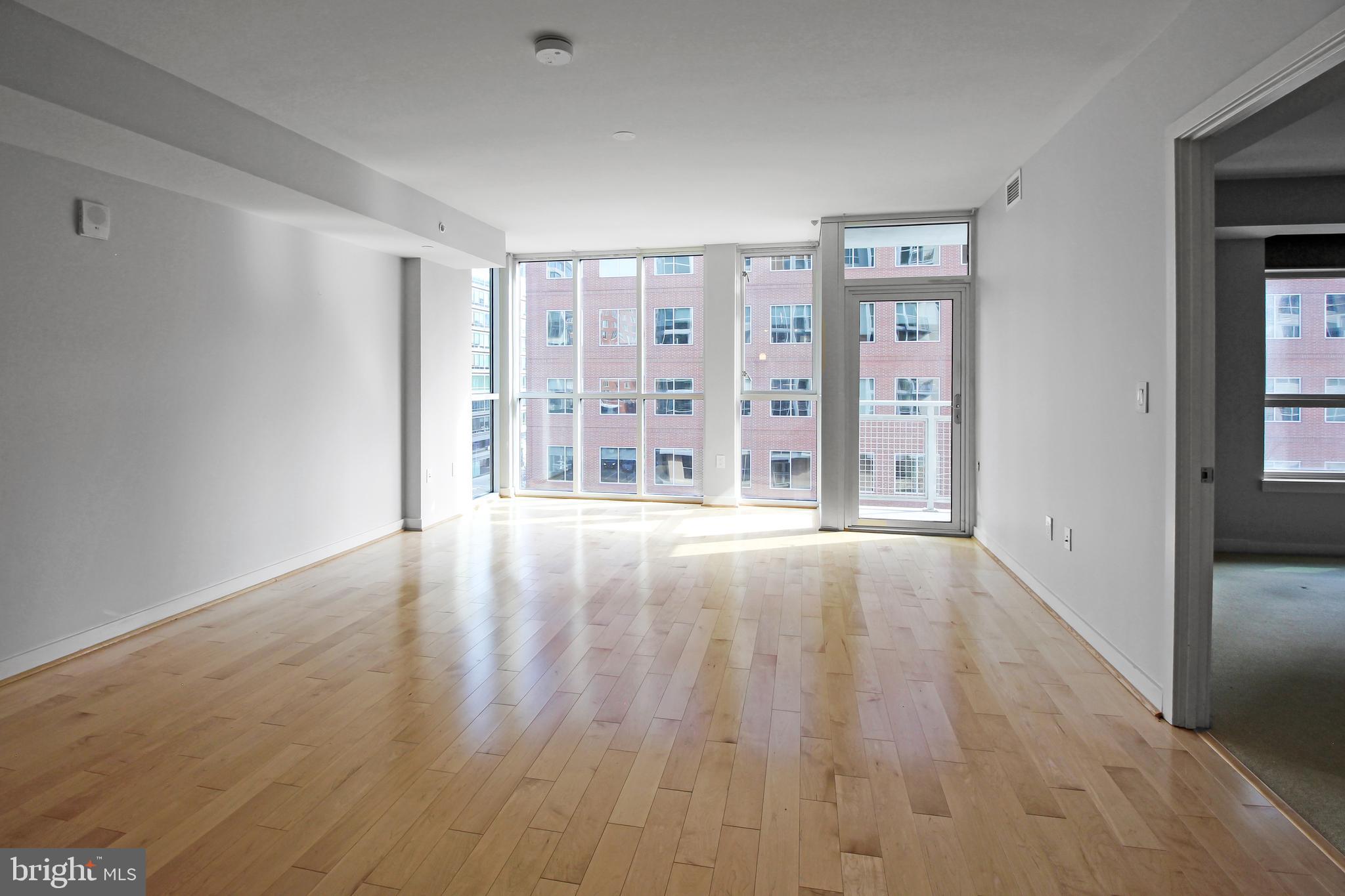 1025 First Street Southeast, Unit 612 Washington, DC 20003 - Photo 8 of 41 wooden floor in an empty room with a window