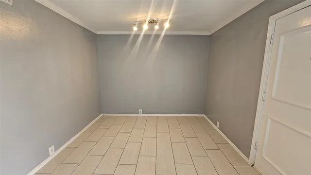 a bathroom with a granite countertop toilet sink and mirror