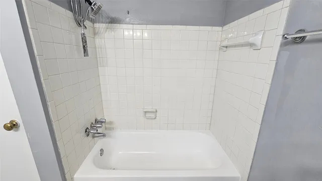a kitchen with granite countertop a refrigerator and a sink