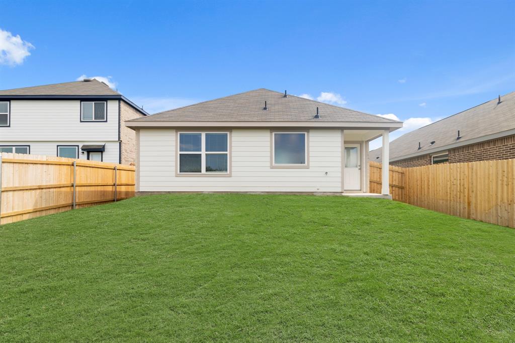 1604 Romans Road Ennis, TX 75119 - Photo 15 of 15 a front view of a house with a yard