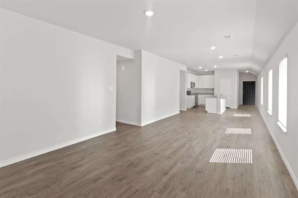 1604 Romans Road Ennis, TX 75119 - Photo 7 of 15 a view of a kitchen with wooden floor