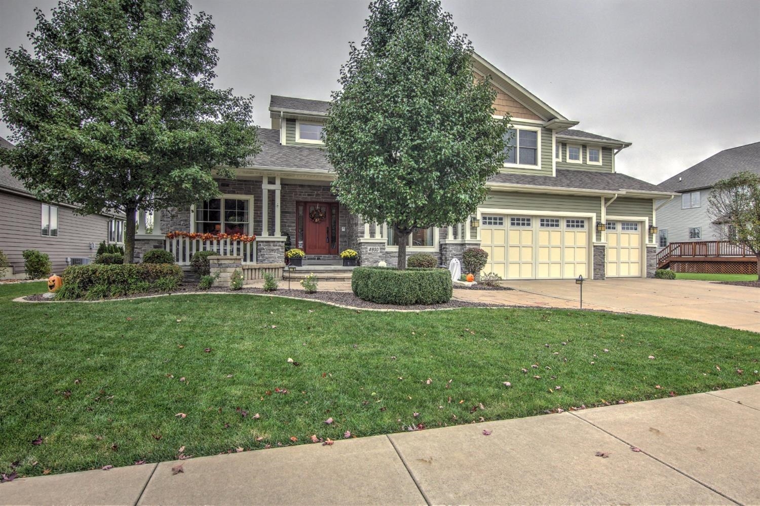 4930 West 100th Lane Crown Point, IN 46307 - Photo 2 of 10 a front view of a house with a yard