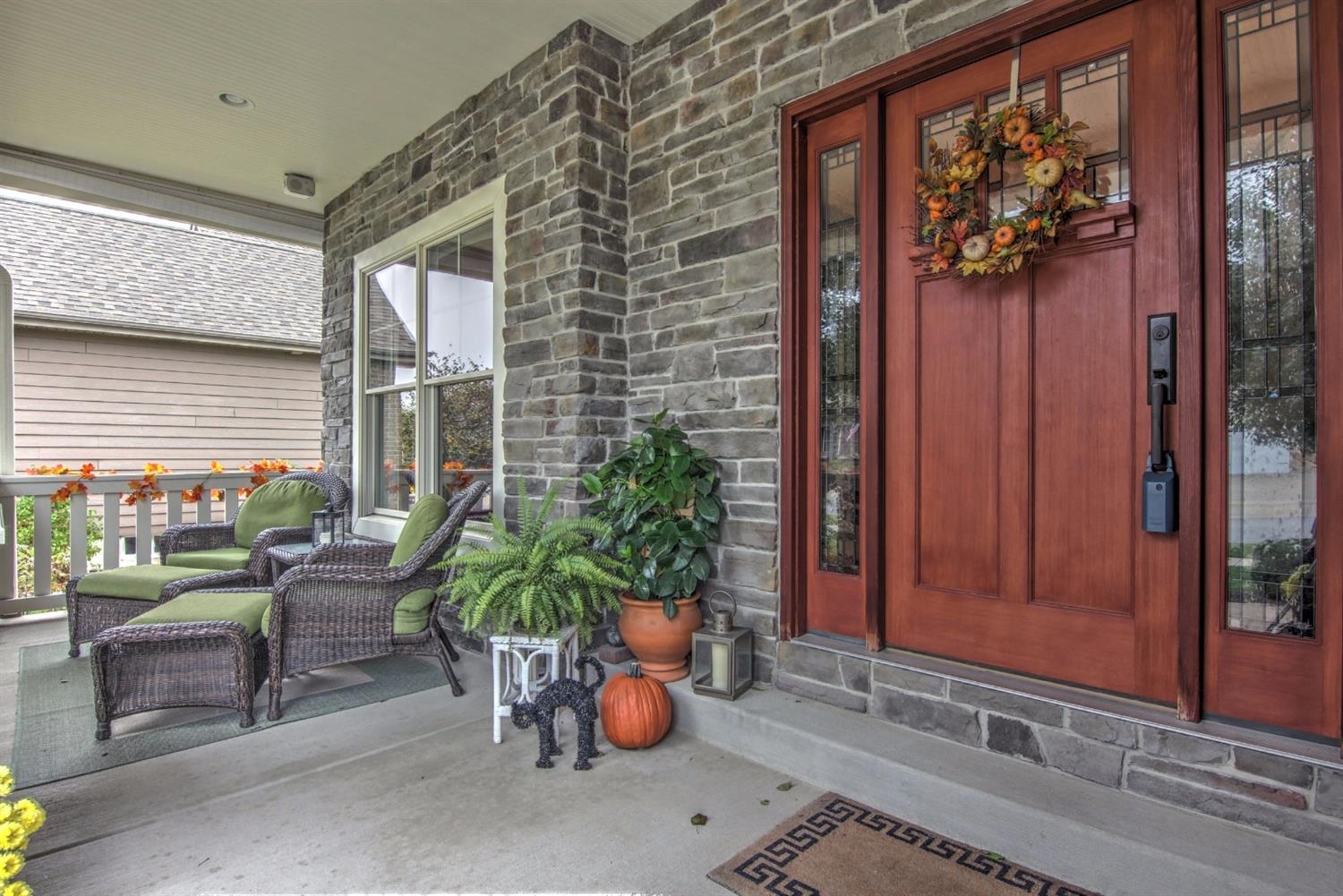 4930 West 100th Lane Crown Point, IN 46307 - Photo 5 of 10 a living room filled with furniture and a potted plant