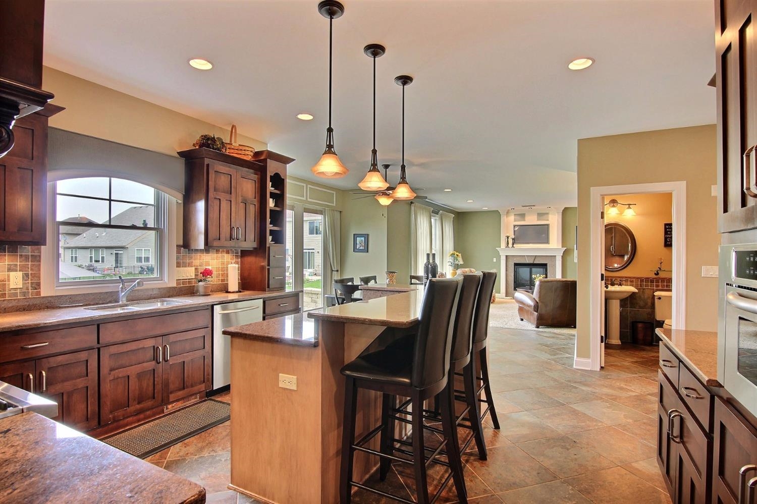 4930 West 100th Lane Crown Point, IN 46307 - Photo 9 of 10 a large kitchen with a table and chairs