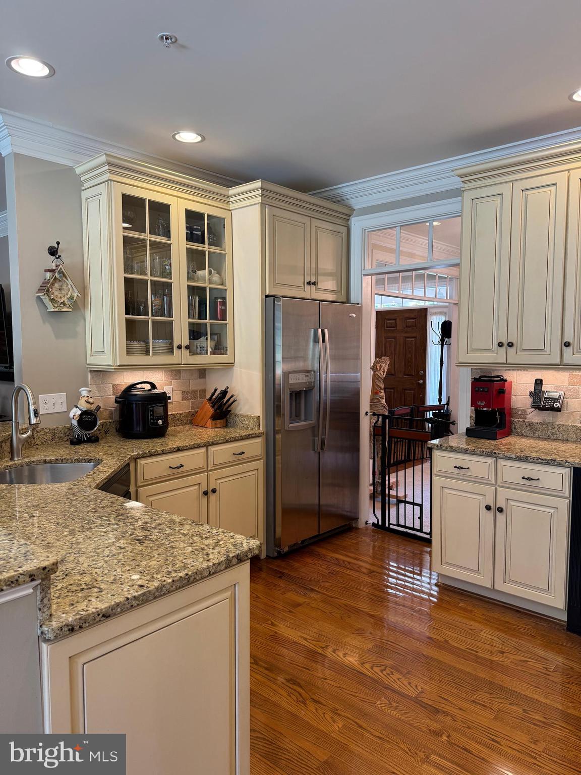 1670 Monument Road Middletown, MD 21769 - Photo 14 of 69 a kitchen with granite countertop a refrigerator stove top oven and sink