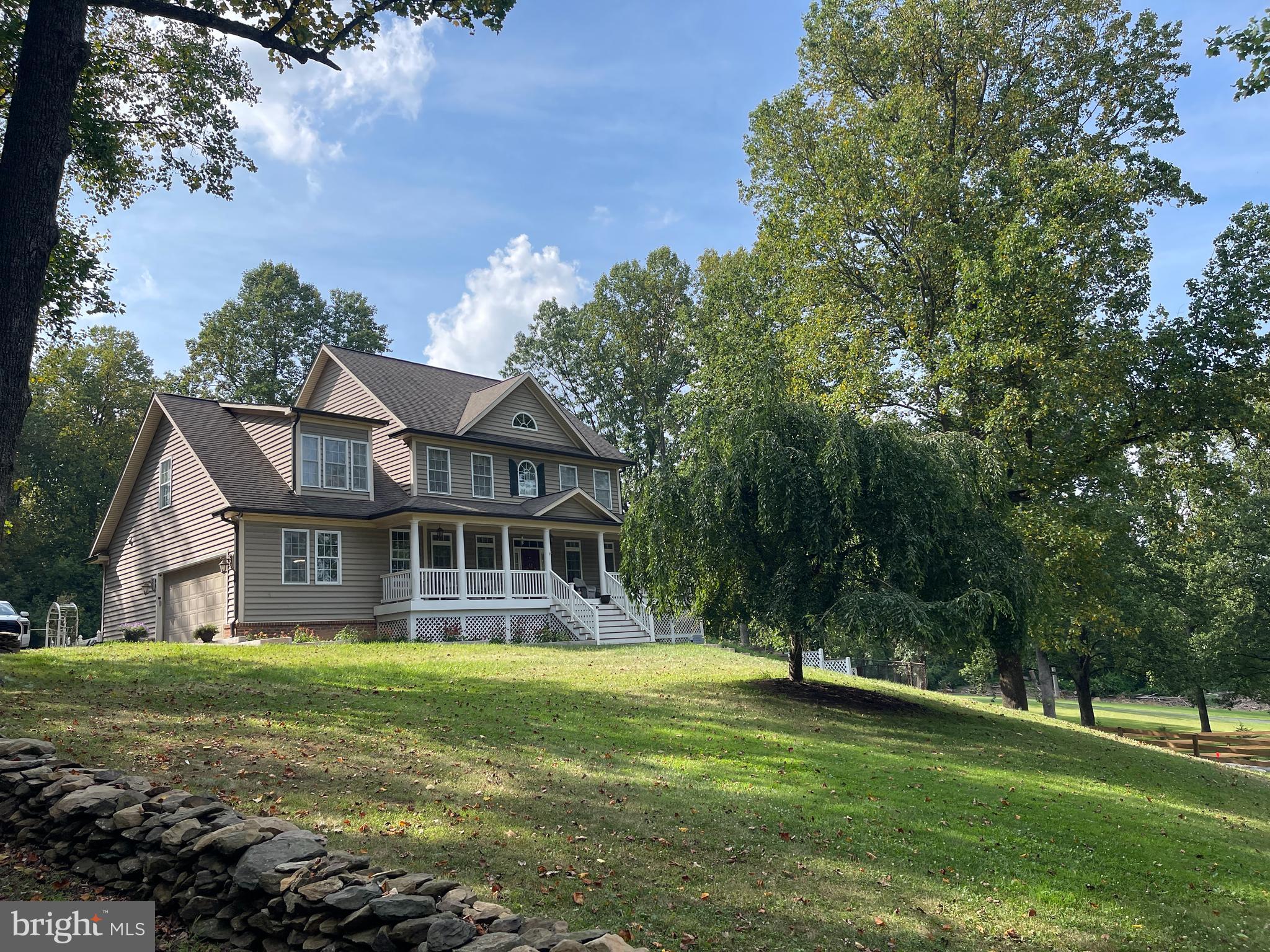 1670 Monument Road Middletown, MD 21769 - Photo 2 of 69 a front view of a house with a yard