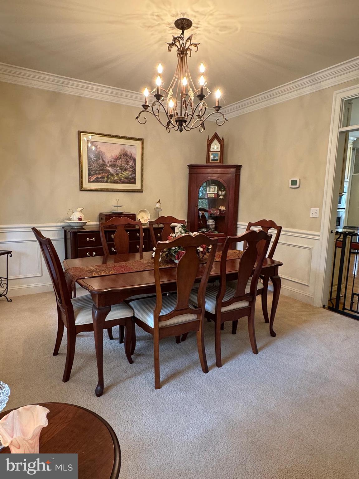 1670 Monument Road Middletown, MD 21769 - Photo 33 of 69 a view of a dining room with furniture and a chandelier