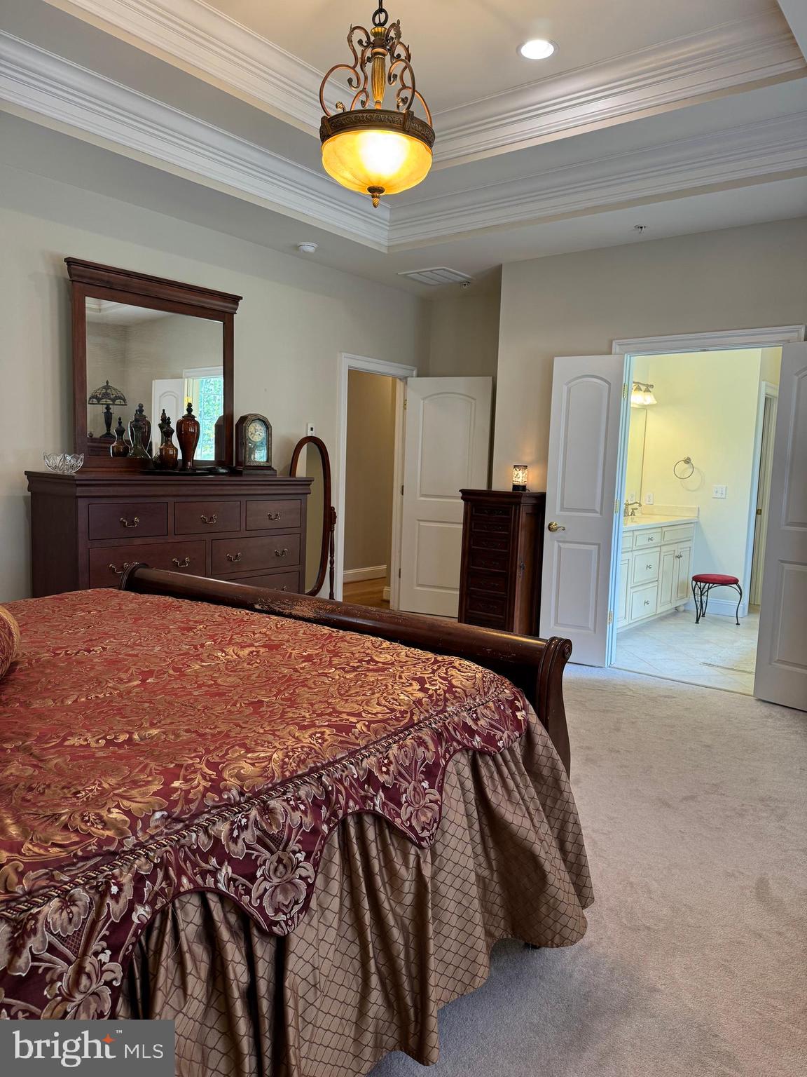 1670 Monument Road Middletown, MD 21769 - Photo 38 of 69 a bedroom with a bed and a chandelier