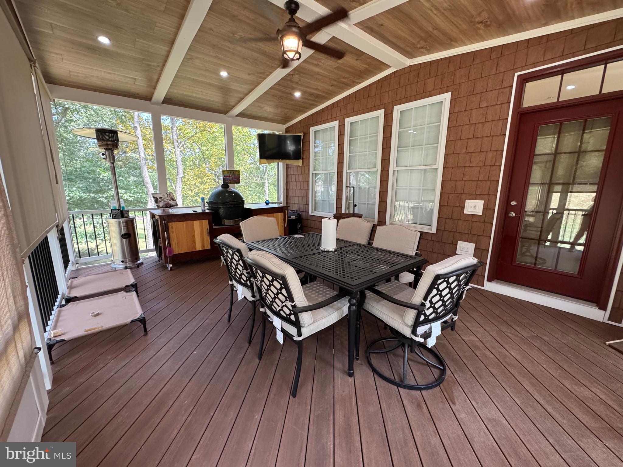 1670 Monument Road Middletown, MD 21769 - Photo 57 of 69 a dining room with furniture large windows and wooden floor