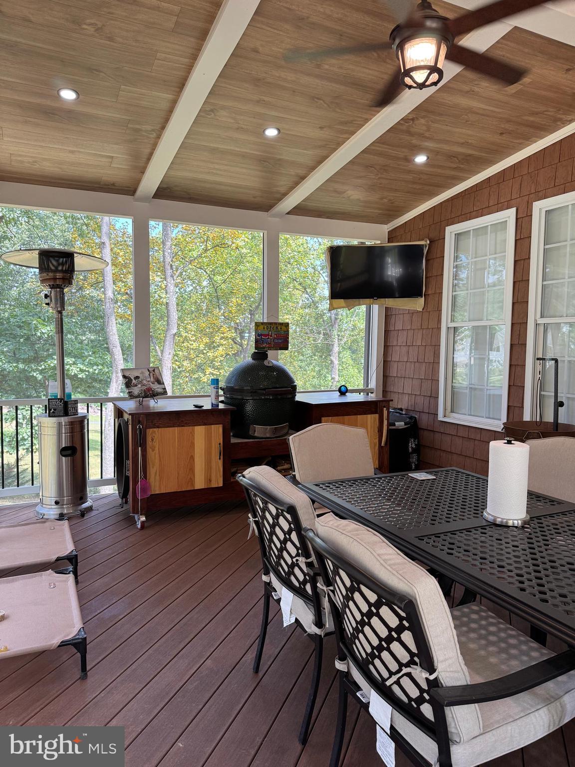 1670 Monument Road Middletown, MD 21769 - Photo 58 of 69 a view of a dining room with furniture large windows and wooden floor
