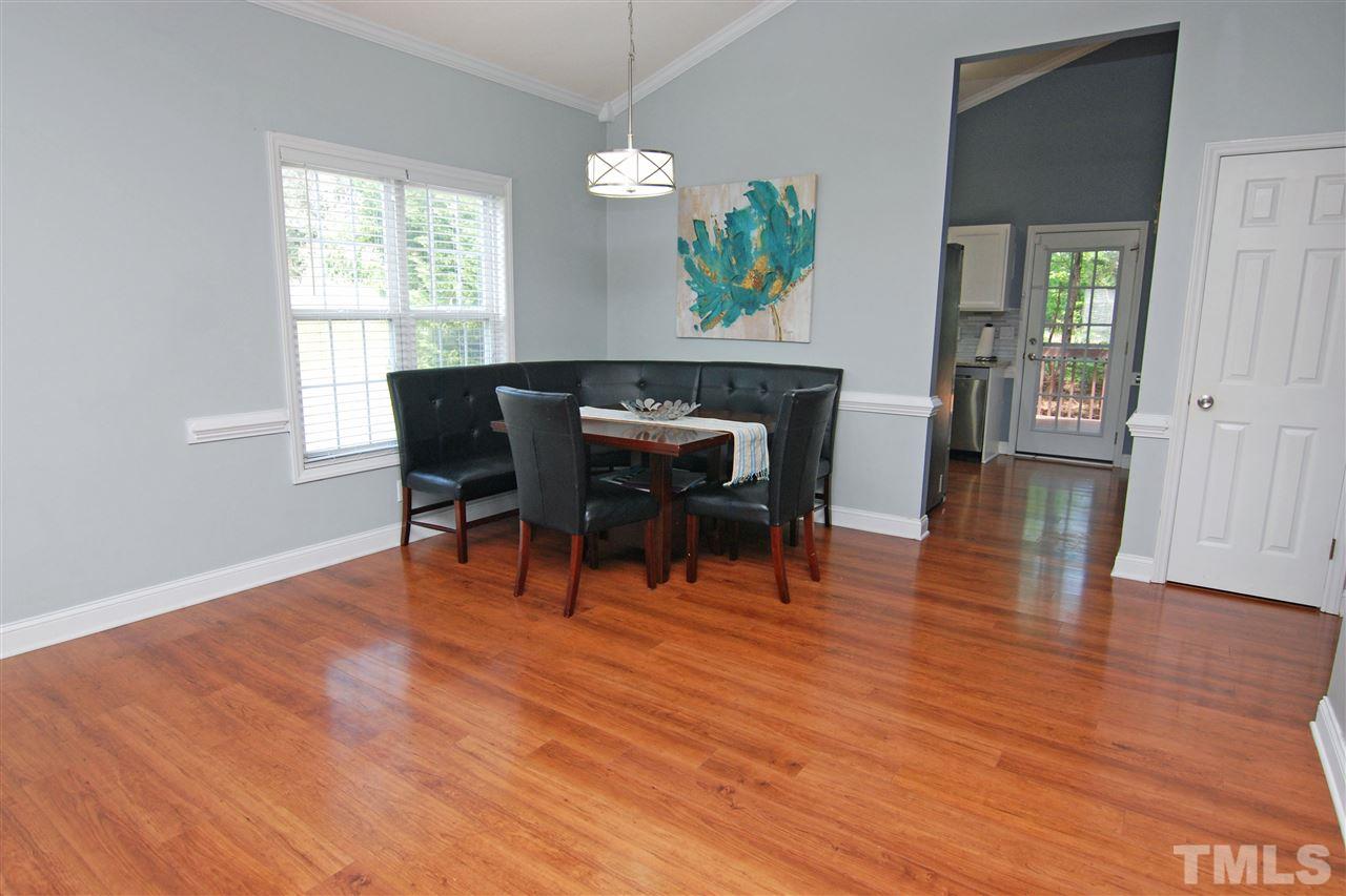 4501 Pinckney Place Raleigh, NC 27604 - Photo 12 of 22 a dining room with furniture and wooden floor