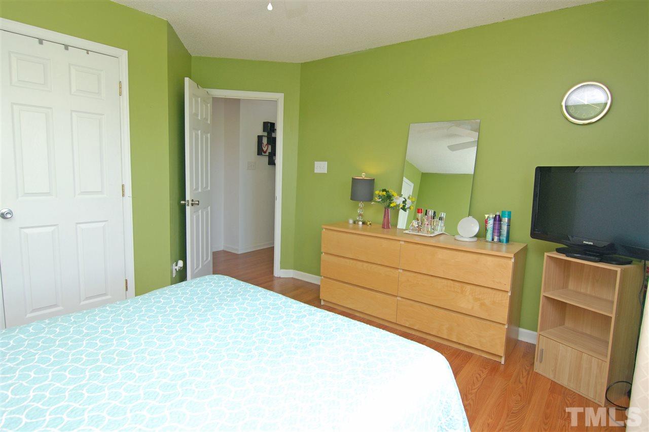 4501 Pinckney Place Raleigh, NC 27604 - Photo 21 of 22 a bedroom with a bed and a flat screen tv
