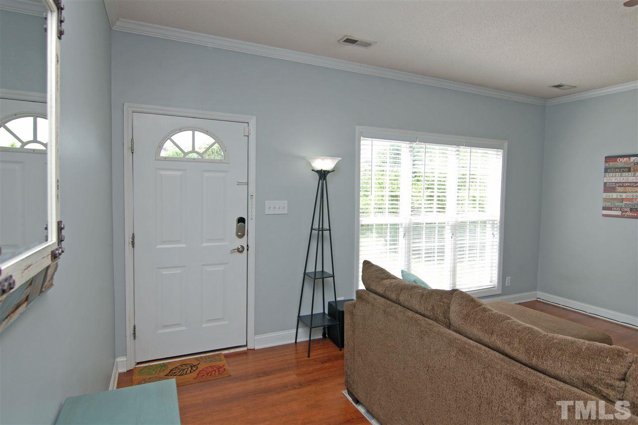 4501 Pinckney Place Raleigh, NC 27604 - Photo 6 of 22 a living room with furniture and a window