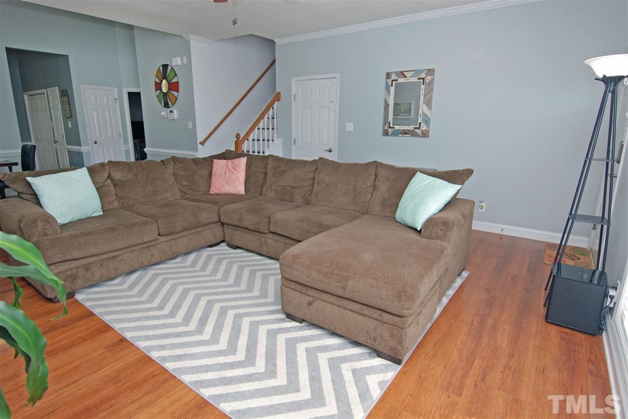 4501 Pinckney Place Raleigh, NC 27604 - Photo 8 of 22 a living room with furniture and wooden floor