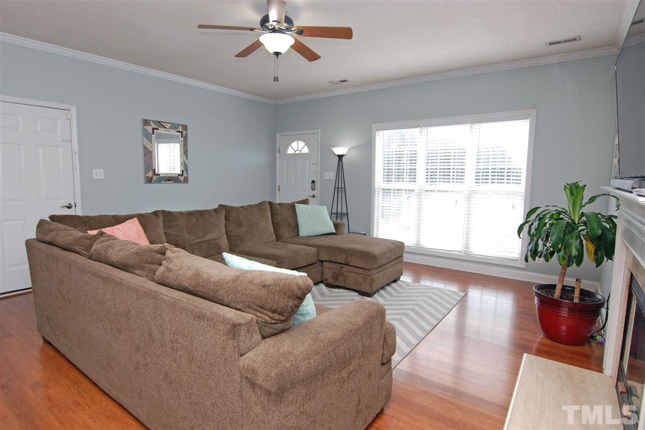 4501 Pinckney Place Raleigh, NC 27604 - Photo 9 of 22 a living room with furniture and a large window