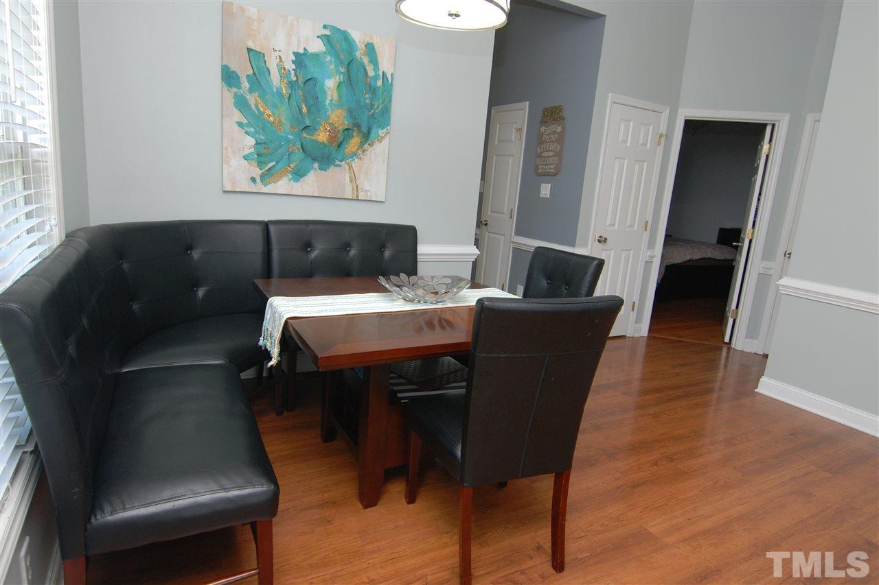 4501 Pinckney Place Raleigh, NC 27604 - Photo 10 of 22 a dining room with furniture and wooden floor