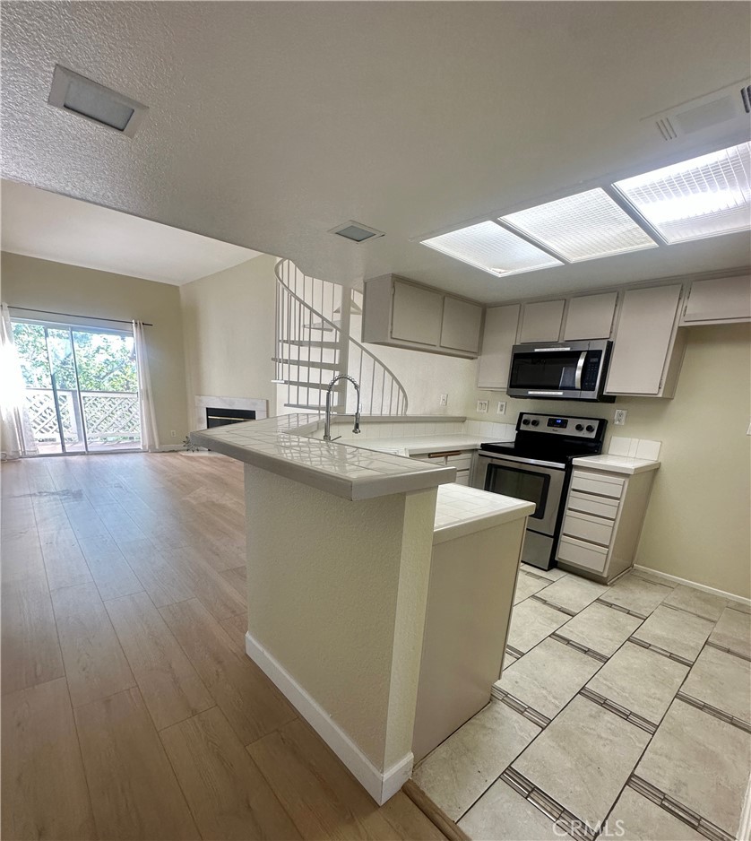 3669 Legato Court Phillips Ranch, CA 91766 - Photo 18 of 30 Kitchen open to living room
