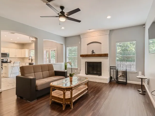 a living room with furniture and a fireplace
