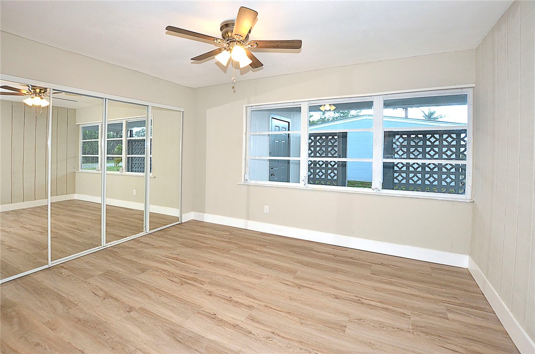 355 6th Road Southwest Vero Beach, FL 32962 - Photo 14 of 23 a view of an empty room with a window and wooden floor