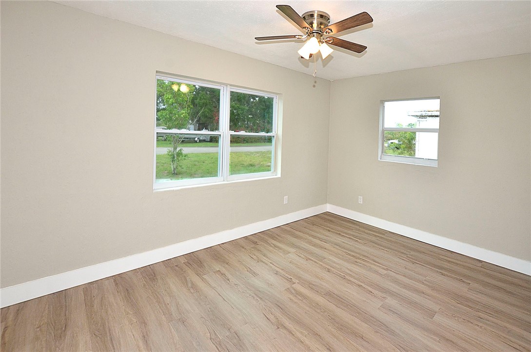 355 6th Road Southwest Vero Beach, FL 32962 - Photo 18 of 23 wooden floor in an empty room with a window