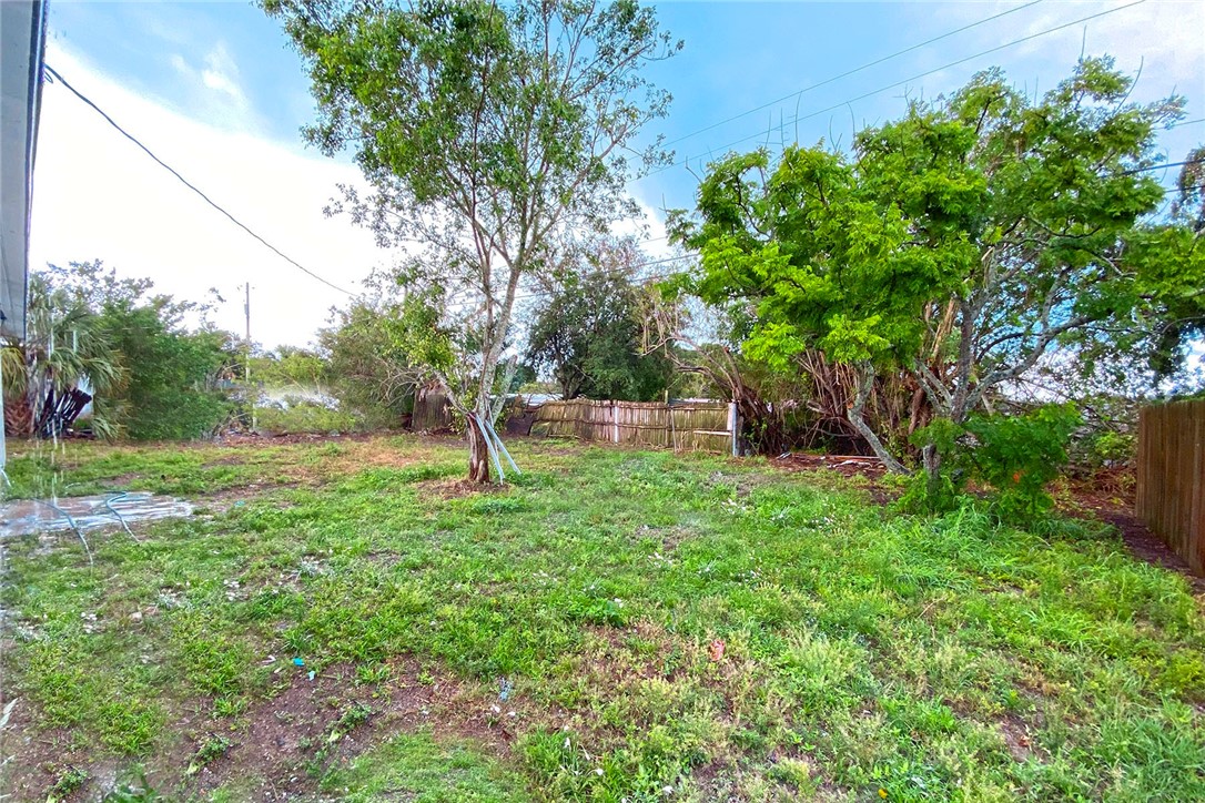 355 6th Road Southwest Vero Beach, FL 32962 - Photo 21 of 23 a front view of a house with a yard