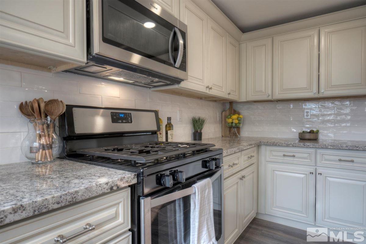 370 Scorpio Circle Reno, NV 89521 - Photo 1 of 25 a kitchen with stainless steel appliances granite countertop a sink a stove and cabinets
