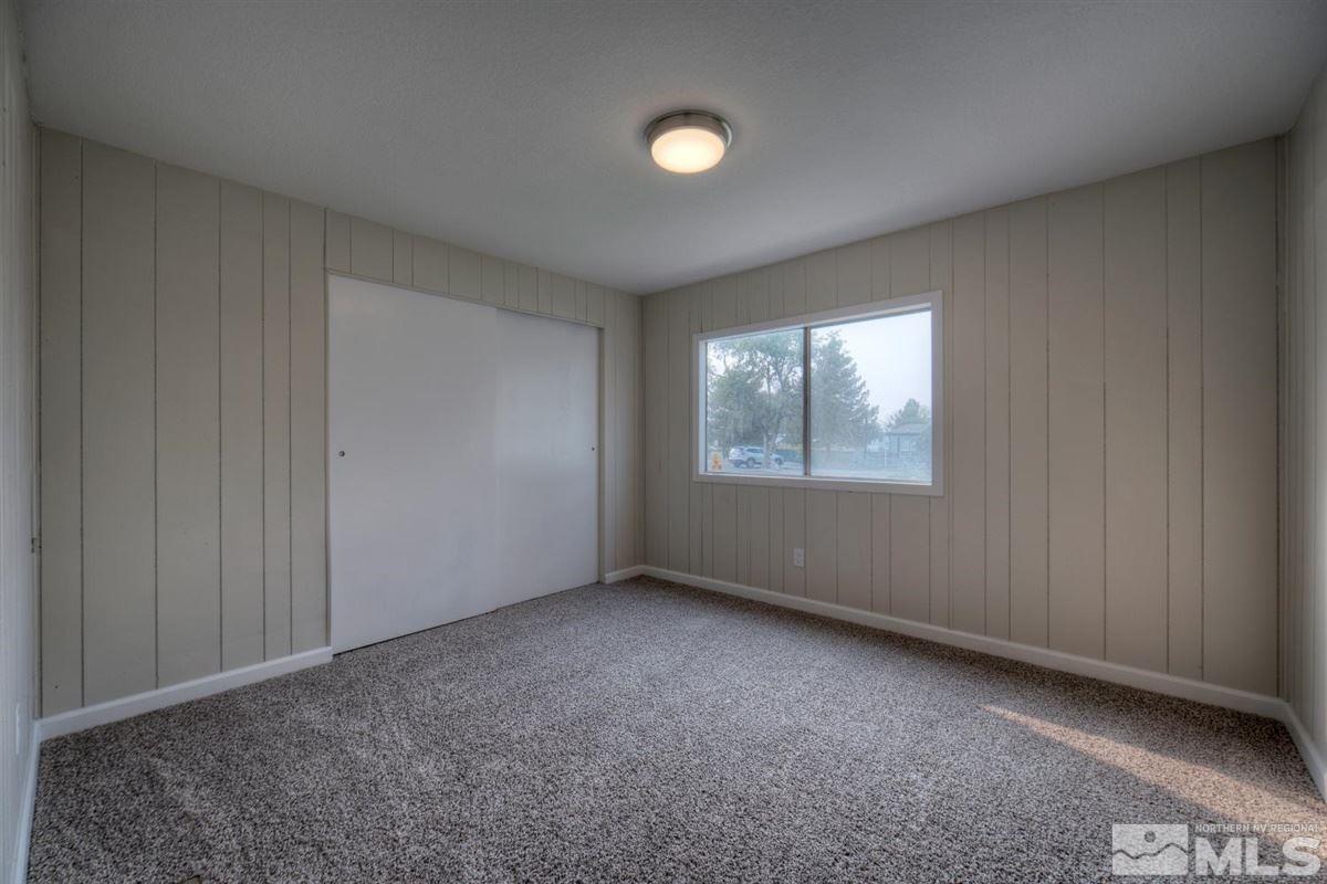 370 Scorpio Circle Reno, NV 89521 - Photo 17 of 25 an empty room with windows and closet
