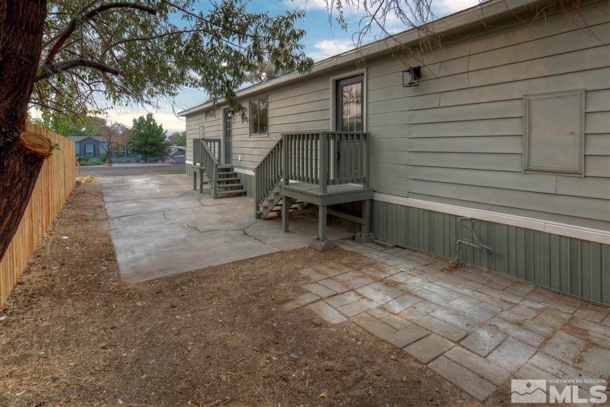 370 Scorpio Circle Reno, NV 89521 - Photo 23 of 25 a view of backyard with a tub and trees