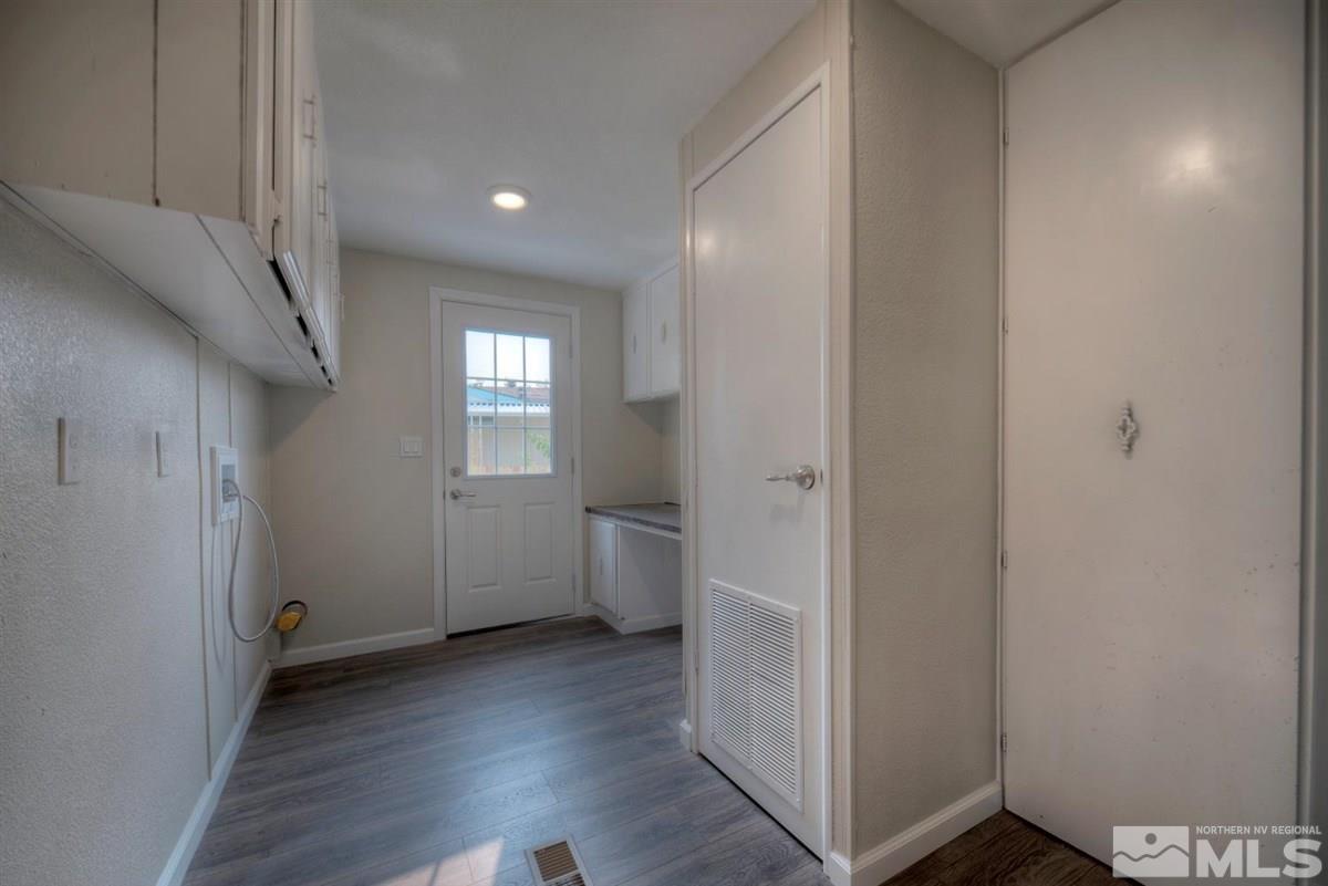 370 Scorpio Circle Reno, NV 89521 - Photo 10 of 25 a view of hallway with window and wooden floor