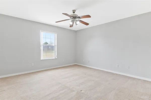 a view of an empty room and a window