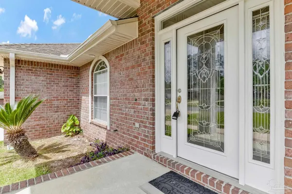 a view of a brick house with a large door