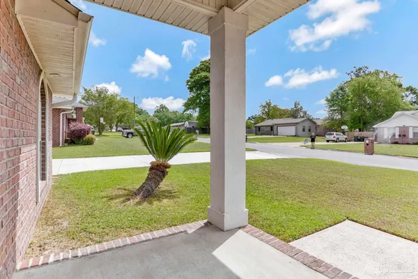 a view of a fountain in front of a house