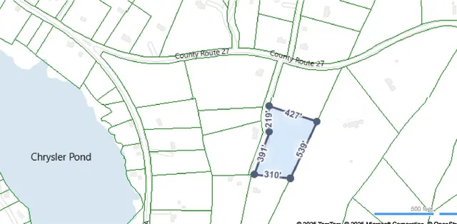 a view of a city with lush green forest