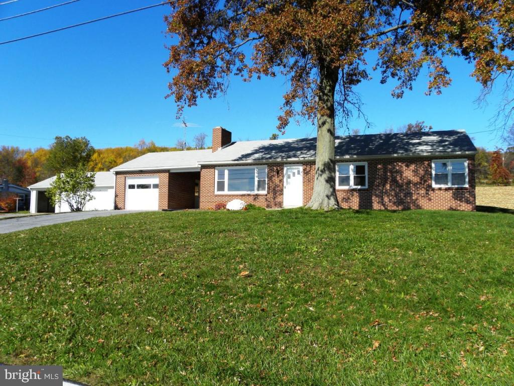 1524 Mountain Road Manheim, PA 17545 - Photo 1 of 17 a front view of a house with garden