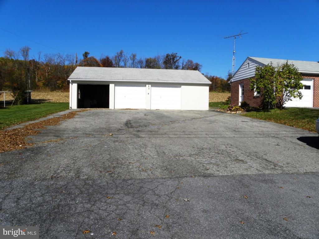 1524 Mountain Road Manheim, PA 17545 - Photo 2 of 17 a view of a house with a yard and a garage