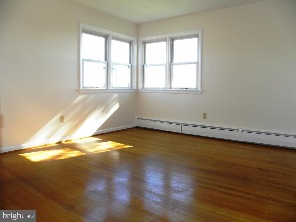 1524 Mountain Road Manheim, PA 17545 - Photo 12 of 17 an empty room with wooden floor and windows